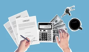 A person signs credit and debt documents while using a calculator; nearby are dollar bills, a cup of coffee, and a set of keys, all on a blue background.