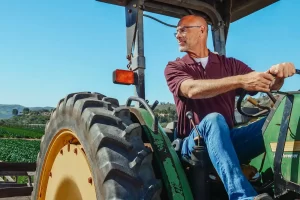 a man driving a tractor
