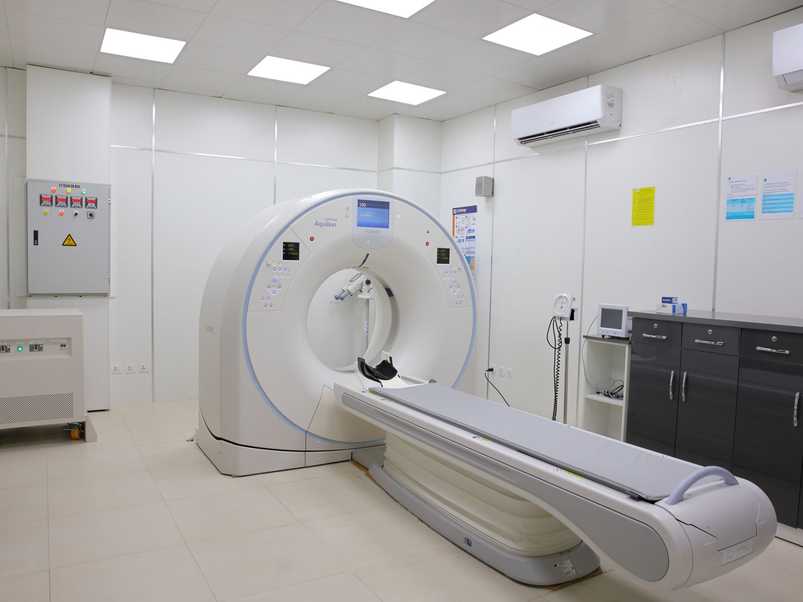Ct scanner and patient table in a modern imaging room