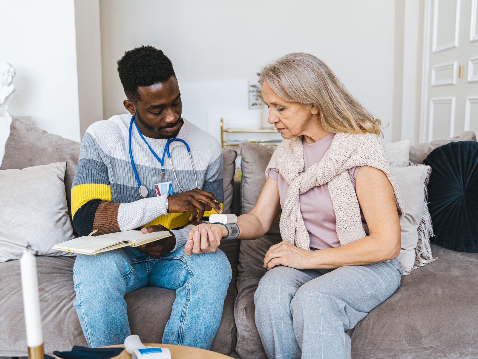 Home Healthcare Vehicle Financing 1 Home health professional checking a senior patient's blood pressure at home