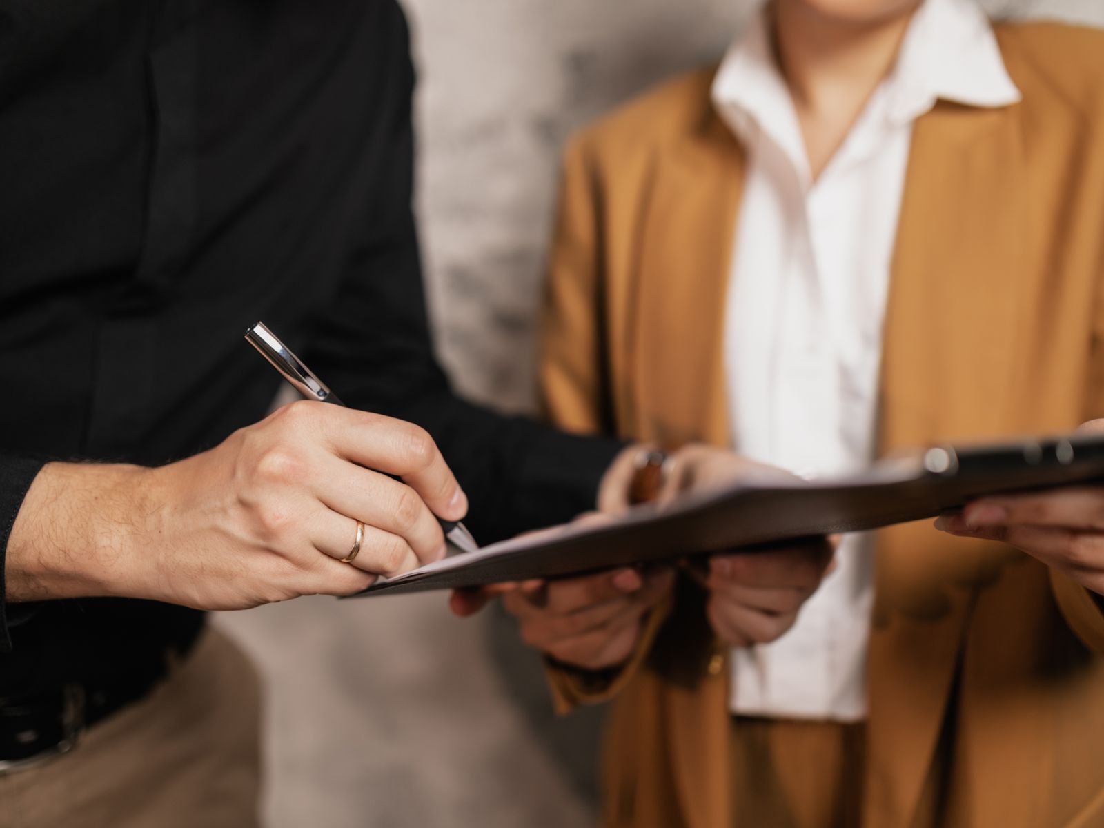 How An Equipment Finance Agreement (Efa) Works 1 Business owner signing an equipment finance agreement on a clipboard