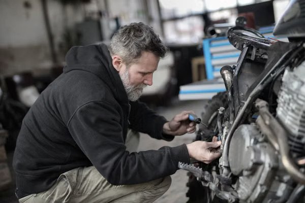 Business loan pre-approval: small business owner working in his repair shop