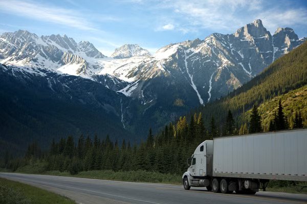 Truck leasing: white semi truck on the highway